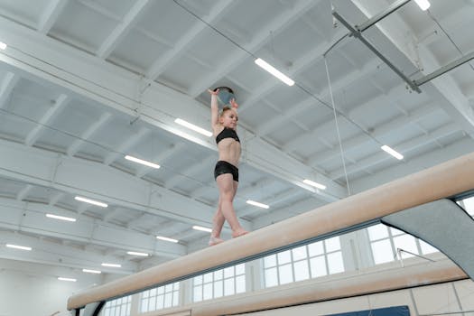 young players practicing balance beam dribbling