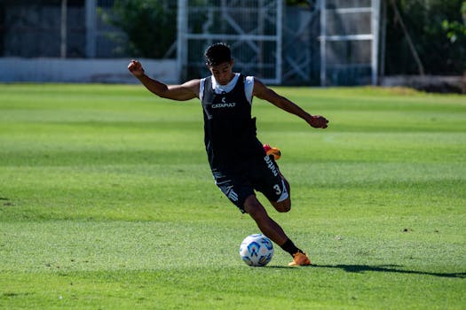 soccer players practicing dribbling