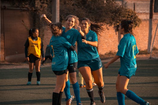 soccer players celebrating a goal