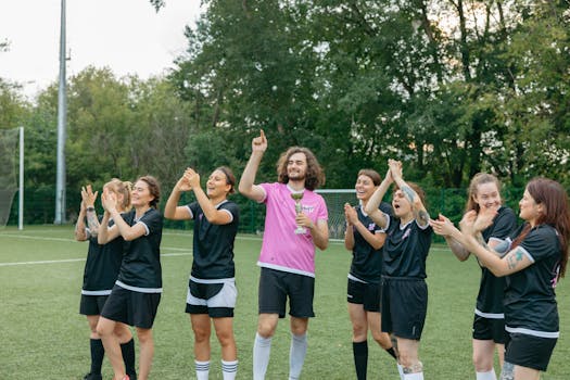 soccer team celebrating a goal