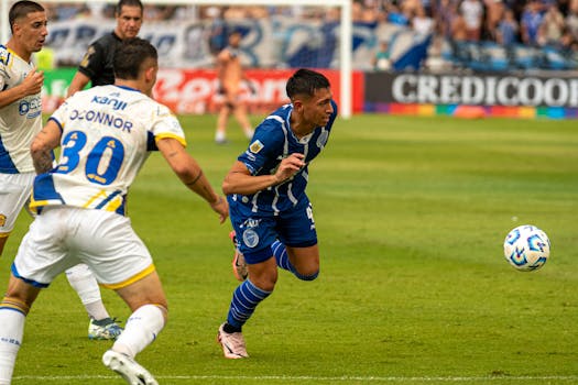 soccer players demonstrating high press strategy during a match