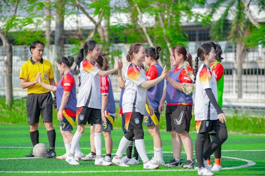 youth soccer game with referee