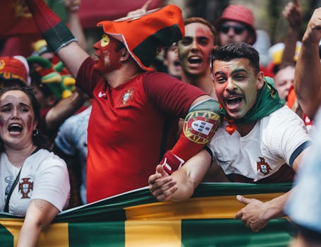 enthusiastic soccer fans cheering