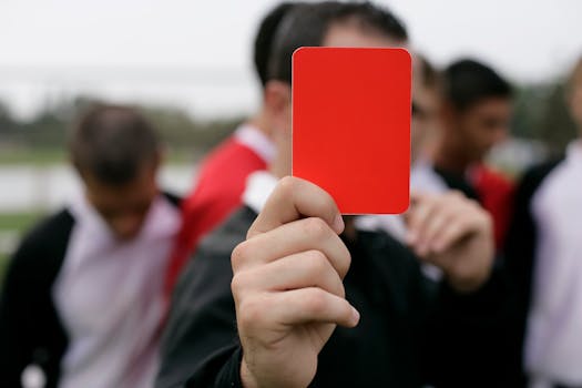 red card being shown by referee