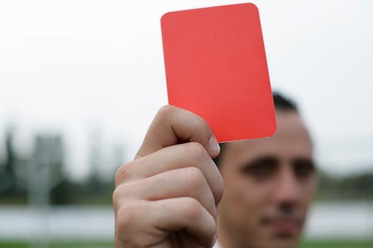 referee showing advantage signal