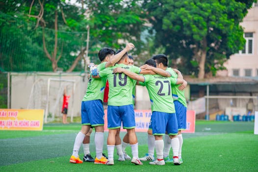 youth soccer team celebrating a goal