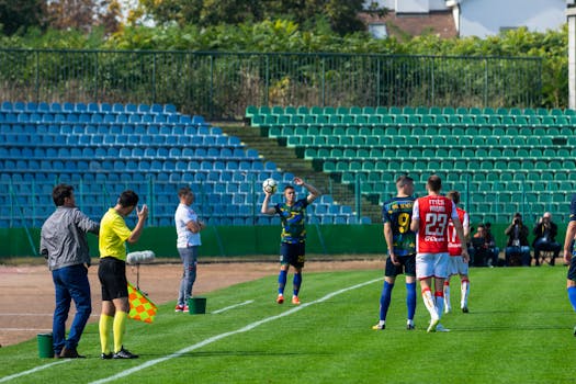 referee signaling a throw-in