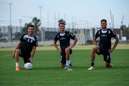 soccer players warming up on the field